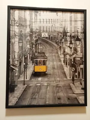 a picture of a yellow streetcar on a city street at Sunrise Apartment in Caniço