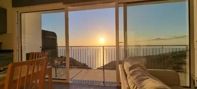 a living room with a view of the ocean at Casa Mar Azul in Arco da Calheta