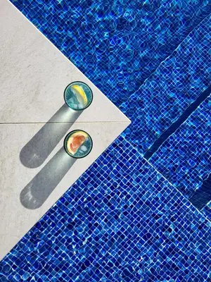 a close up of a blue tile floor with two spoons at Casa Mar Azul in Arco da Calheta