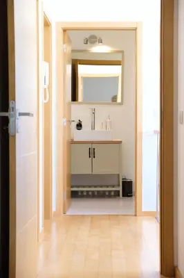 a bathroom with a sink and a mirror at GuestReady - Charming Caniço Retreat in Caniço