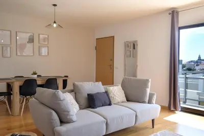 a living room with a couch and a table at GuestReady - Charming Caniço Retreat in Caniço