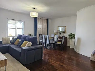 a living room with a couch and a table at A Pérola da Madeira by Rentallido in Funchal
