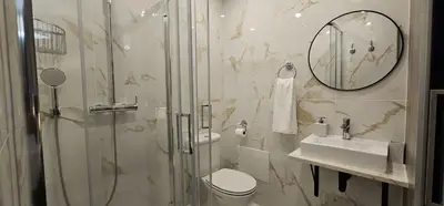 a bathroom with a shower and a toilet and a sink at A Pérola da Madeira by Rentallido in Funchal