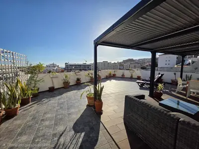 a patio with potted plants on a roof at A Pérola da Madeira by Rentallido in Funchal