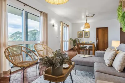 a living room with a couch and chairs at Green Valley by Homie in Porto Moniz