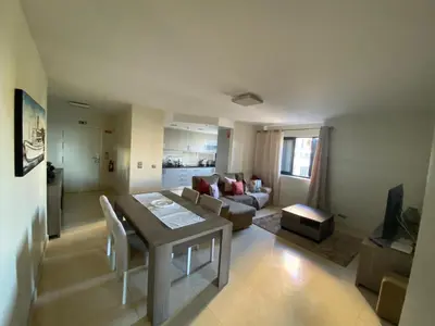 a living room with a table and a couch at Seaview Nice&Easy - Free parking in Funchal