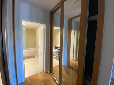 a bathroom with two mirrors and a bath tub at Seaview Nice&Easy - Free parking in Funchal