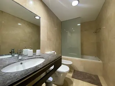 a bathroom with a sink and a tub and a toilet at Seaview Nice&Easy - Free parking in Funchal