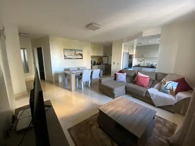a living room with a couch and a table at Seaview Nice&Easy - Free parking in Funchal