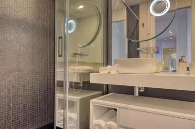a bathroom with a sink and a shower at Becas Place, a Home in Madeira in Funchal
