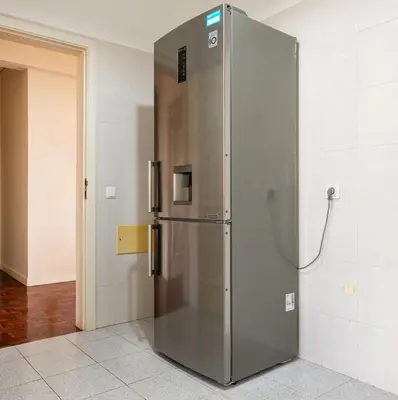 a large stainless steel refrigerator in a room at GuestReady - Family-Friendly Haven in Funchal in Funchal