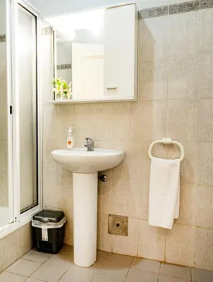 a bathroom with a sink and a mirror at GuestReady - Family-Friendly Haven in Funchal in Funchal