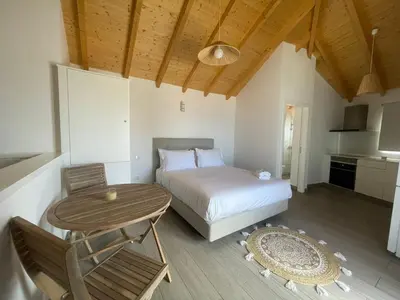 a bedroom with a bed and a table and a table sidx sidx sidx at Tides proprety - High tide in Paul do Mar
