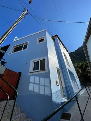 a white house with stairs leading up to it at Tides proprety - High tide in Paul do Mar