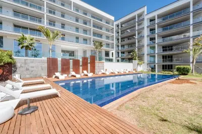 an image of a swimming pool in a building at Suite BM - 3 Pools-Gym-AC-Huge Balcony Sea View in Funchal