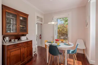 a kitchen with a table and chairs in a room at Villa Quebra Costas by An Island Apart in Funchal