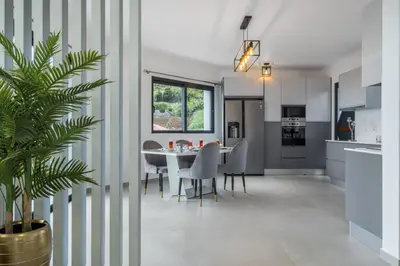 a kitchen and dining room with a table and chairs at Landscape View by Homie in Canhas