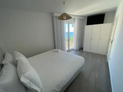 an empty hallway with two white doors in a building at Tides proprety - Medium Tide in Paul do Mar