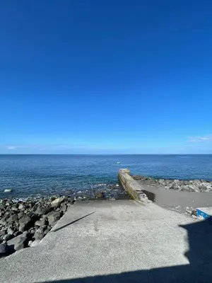 a view of the ocean from a rocky beach at Tides proprety - Low tide in Paul do Mar