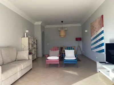 a living room with a couch and chairs and a table at A Casa Lagos, Golf in Lagos
