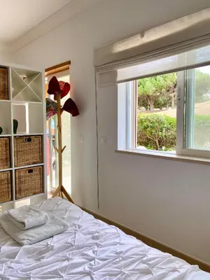 a bedroom with a bed and a window at A Casa Lagos, Golf in Lagos