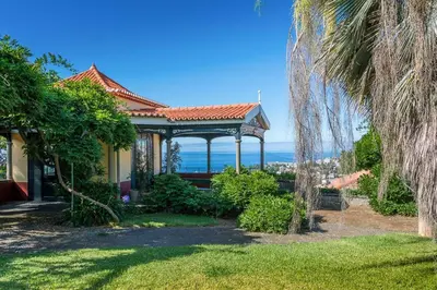 a house with a gazebo in a yard at Villa Quinta Santa Luzia in Funchal