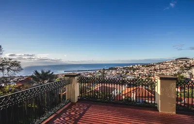 a balcony with a view of the ocean at Villa Quinta Santa Luzia in Funchal