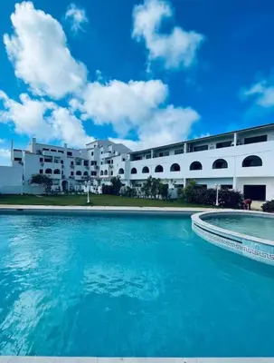 a large swimming pool in front of a building at New Flat surround by beaches. in Sagres