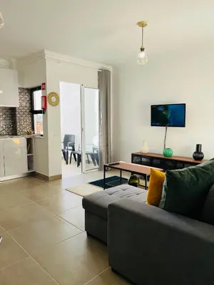 a living room with a couch and a table at New Flat surround by beaches. in Sagres