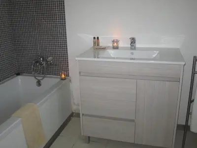 a bathroom with a sink and a bath tub at Atlantic Sagres in Sagres