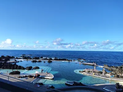 a swimming pool in the middle of the ocean at Quinta' Home in Ribeira da Janela
