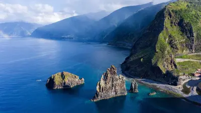 an island in the middle of a large body of water at Quinta' Home in Ribeira da Janela