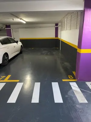 a white car parked in a parking garage at Funchal Balcony in Funchal