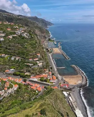 an aerial view of a town next to the ocean at Seaside & Mountain Views & Cozy Calheta Retreat MQ1 in Calheta
