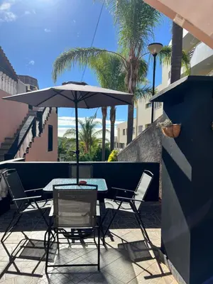 a living room with a couch and a table at Seaside & Mountain Views & Cozy Calheta Retreat MQ1 in Calheta