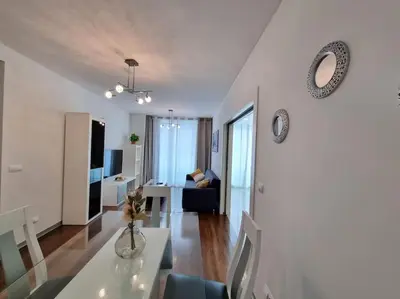a white living room with a table and a living room at Funchal Centrum - La Vie Apartment with Parking! in Funchal