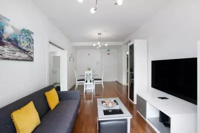 a living room with a couch and a table at Funchal Centrum - La Vie Apartment with Parking! in Funchal