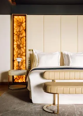 a bedroom with a bed and a fireplace at The Reserve - within Savoy Palace - The Leading Hotels of the World in Funchal