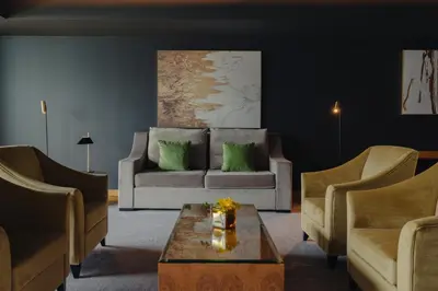 a living room with a couch and two chairs at The Reserve - within Savoy Palace - The Leading Hotels of the World in Funchal