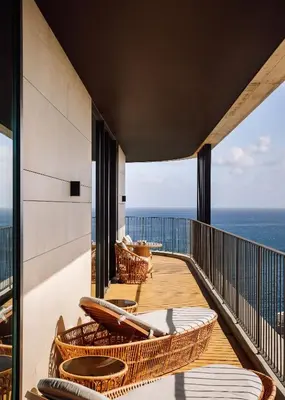 a balcony with chairs and a view of the ocean at The Reserve - within Savoy Palace - The Leading Hotels of the World in Funchal