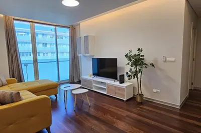 a living room with a couch and a flat screen tv at Ponte de Estrelas Plaza by Rentallido in Funchal