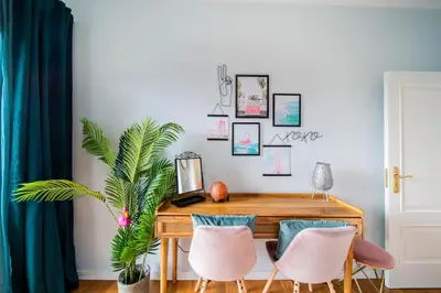 a dining room with a wooden table and chairs at Island Feeling in Funchal