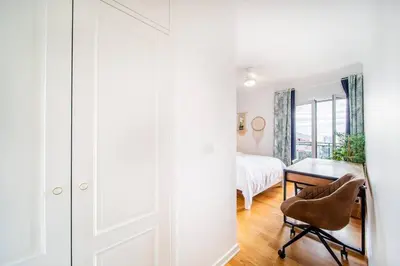 a bedroom with a bed and a desk and a chair at Island Feeling in Funchal