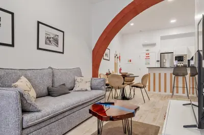 a living room with a couch and a table at Tanoeiros Residence by An Island Apart in Funchal