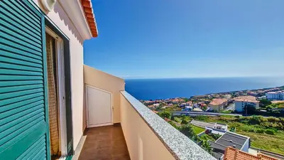 a balcony with a view of the ocean at Lucy Sweet Home by LovelyStay in Caniço