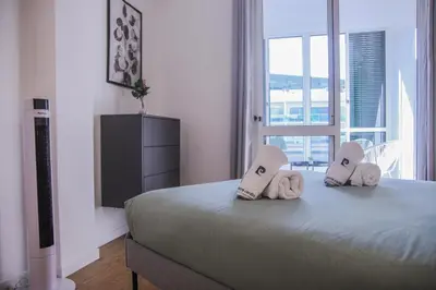 a bedroom with a bed with towels on it at Barreiros ArchDesign Apartment in Funchal