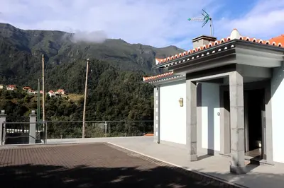 a white building with a view of a mountain at Casa Da Achada, By OP in São Vicente