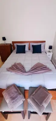 a large white bed with two pillows on it at Franciscus 1a in Funchal