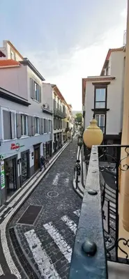 an empty city street with buildings and a street light at Franciscus 1a in Funchal
