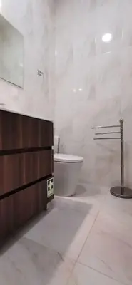 a white bathroom with a toilet and a sink at Franciscus 1a in Funchal